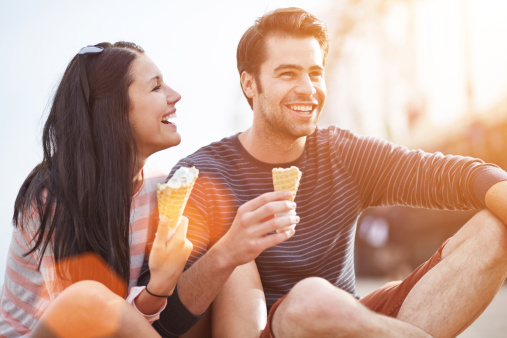 romantic couple eating ice cream at park.jpg
